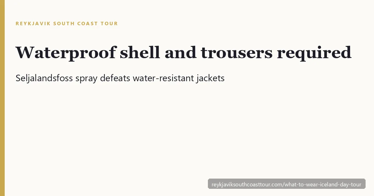 Layered waterproof clothing and sturdy boots for an Iceland South Coast day tour at a windy waterfall
